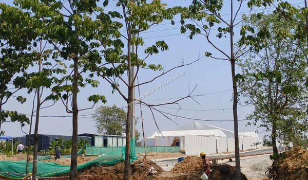 Ongoing boundary landscaping work and green net barricading around the perimeter of the Prestige Kollur Hyderabad property, situated close to the Nehru Outer Ring Road as of March 03 , 2026.
