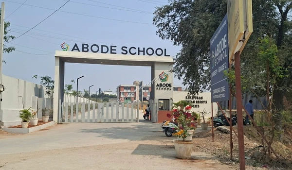 View of the secure gates and greenery at Abode School, an educational institution near Prestige Kollur in Hyderabad