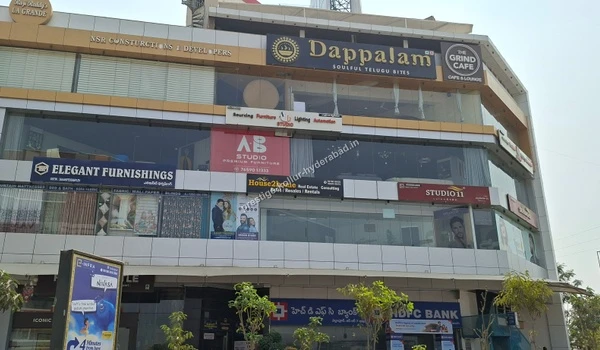 Commercial complex featuring Dappalam restaurant, HDFC Bank, and interior studios for the convenience of Prestige Kollur residents in Hyderabad