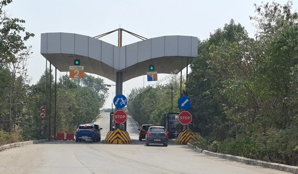 Vehicles passing through the fast access toll gates on the major expressway route leading to Prestige Kollur in Hyderabad