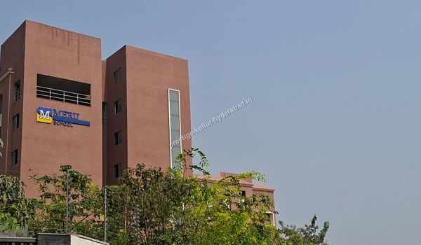 Side perspective of the Meru School building showcasing its modern design close to Prestige Kollur in Hyderabad