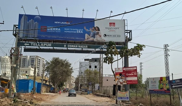 Road signage pointing towards Tellapur and Osman Nagar demonstrating the prime location and connectivity of Prestige Kollur in Hyderabad