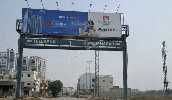 Close up of the road gantry directing commuters to Tellapur and Osman Nagar emphasizing the prime location of Prestige Kollur in Hyderabad