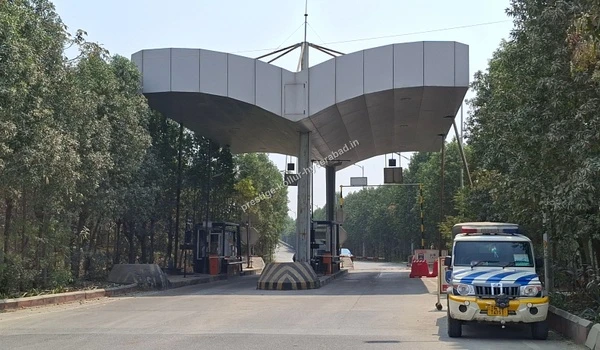 Wide perspective of the highway toll booths connecting major routes directly to the Prestige Kollur residential project in Hyderabad