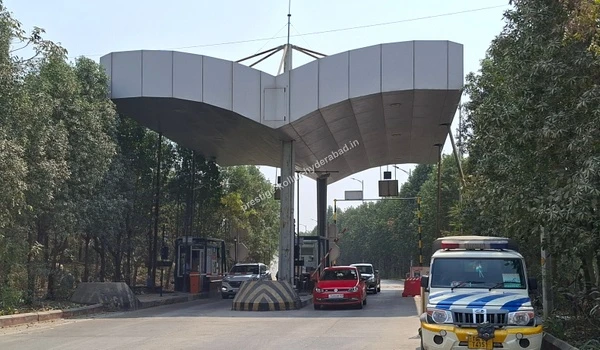 Secure toll gate and checkpoint on the highway ensuring safe and fast road connectivity to Prestige Kollur in Hyderabad