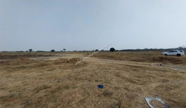 Expansive land view and site clearing at the Prestige Kollur project